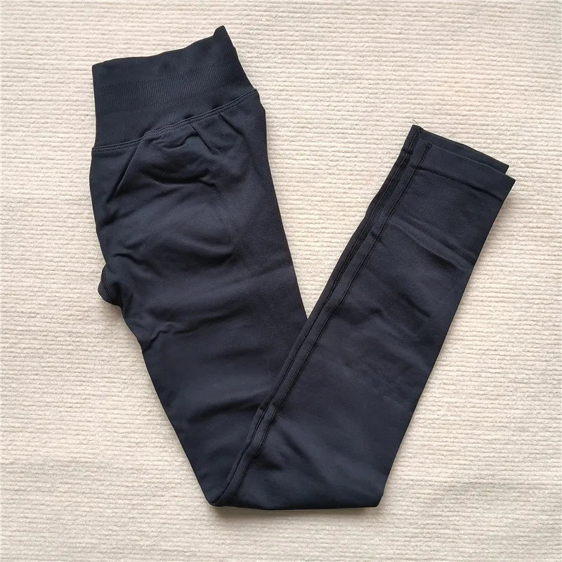 KiKis black Women Scrunch Butt Seamless Leggings folded on light textured surface