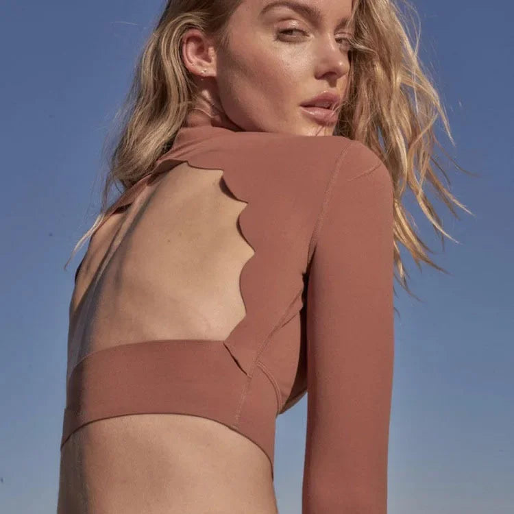KiKis long sleeve lace back yoga top in brown with scalloped edge detail on the open back