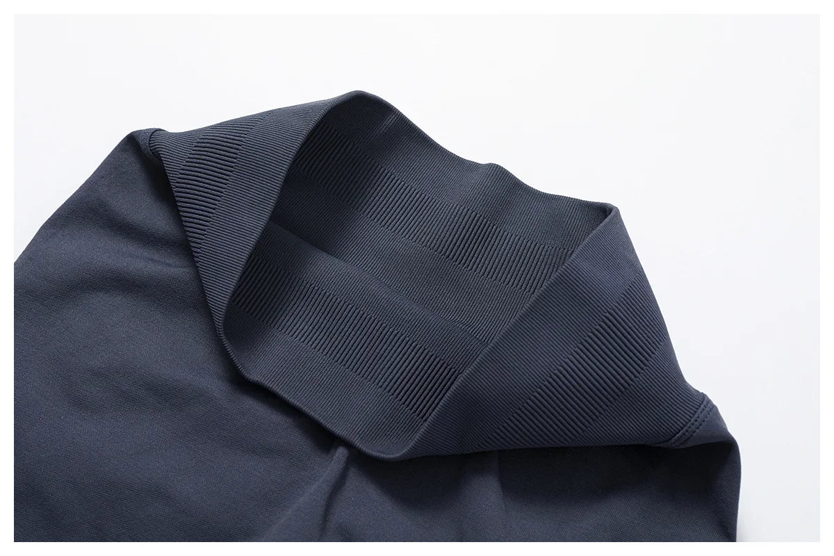 Close-up of black fabric texture and waistband detail of KiKis women’s seamless gym set