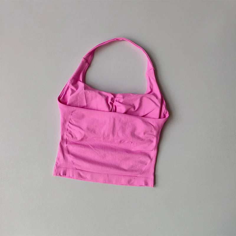 KiKis pink halter neck sports bra for women with a seamless design and supportive fit