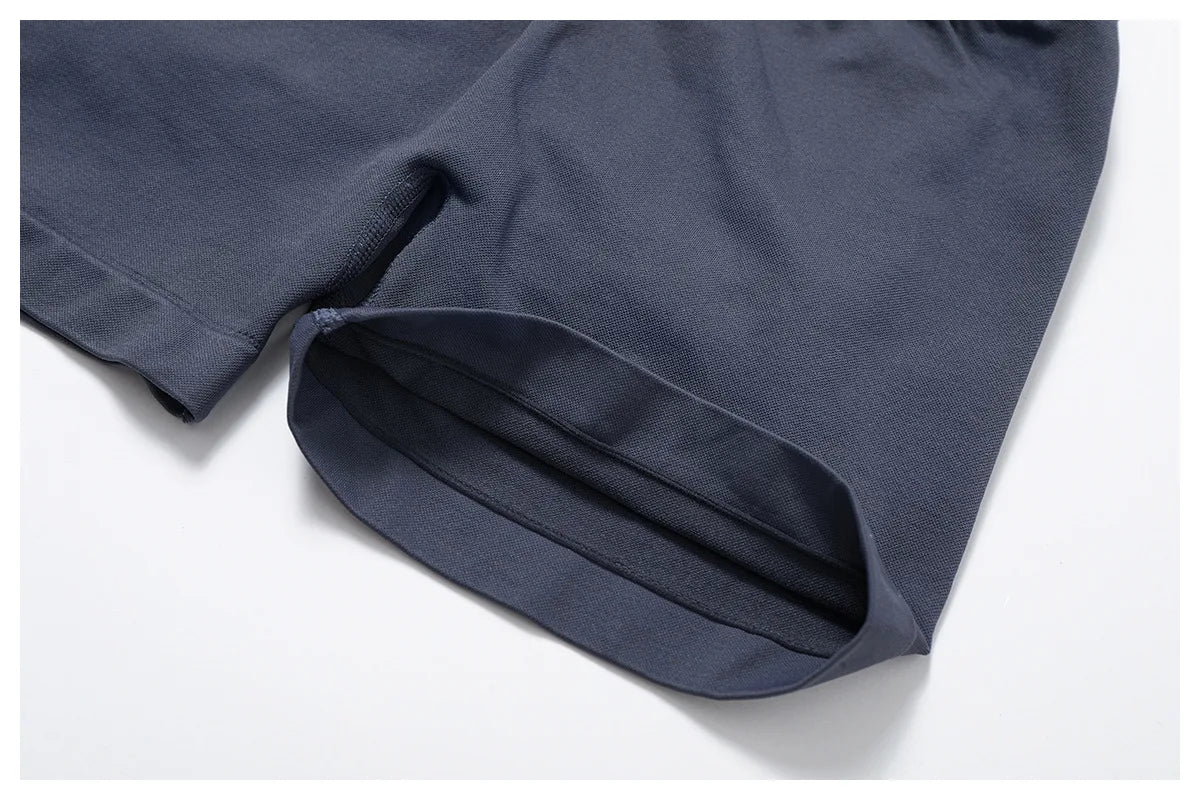 Close-up of navy blue women's seamless gym set shorts made by KiKis with smooth fabric edges