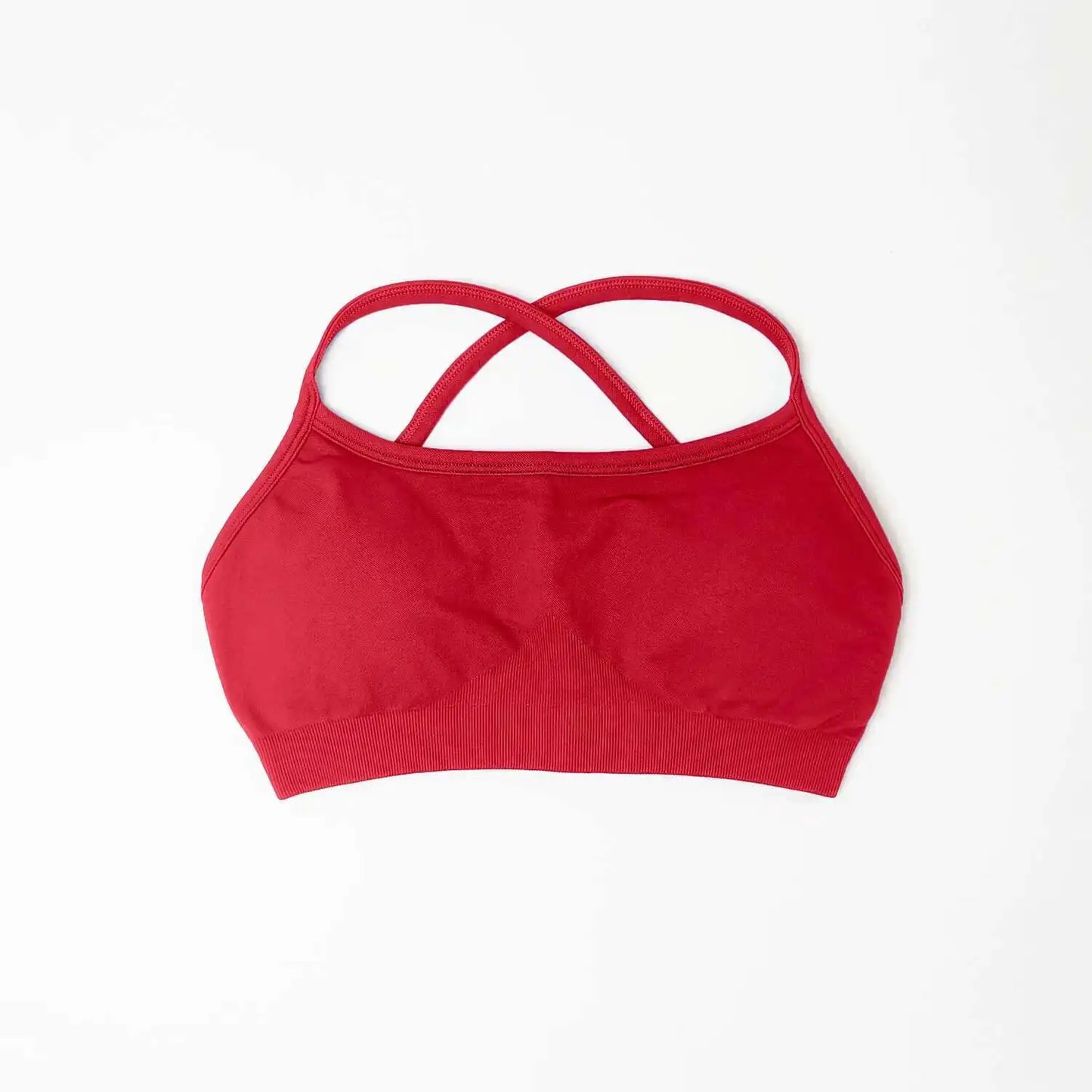 Red seamless sports bra for women with crossed back straps and soft stretch fabric