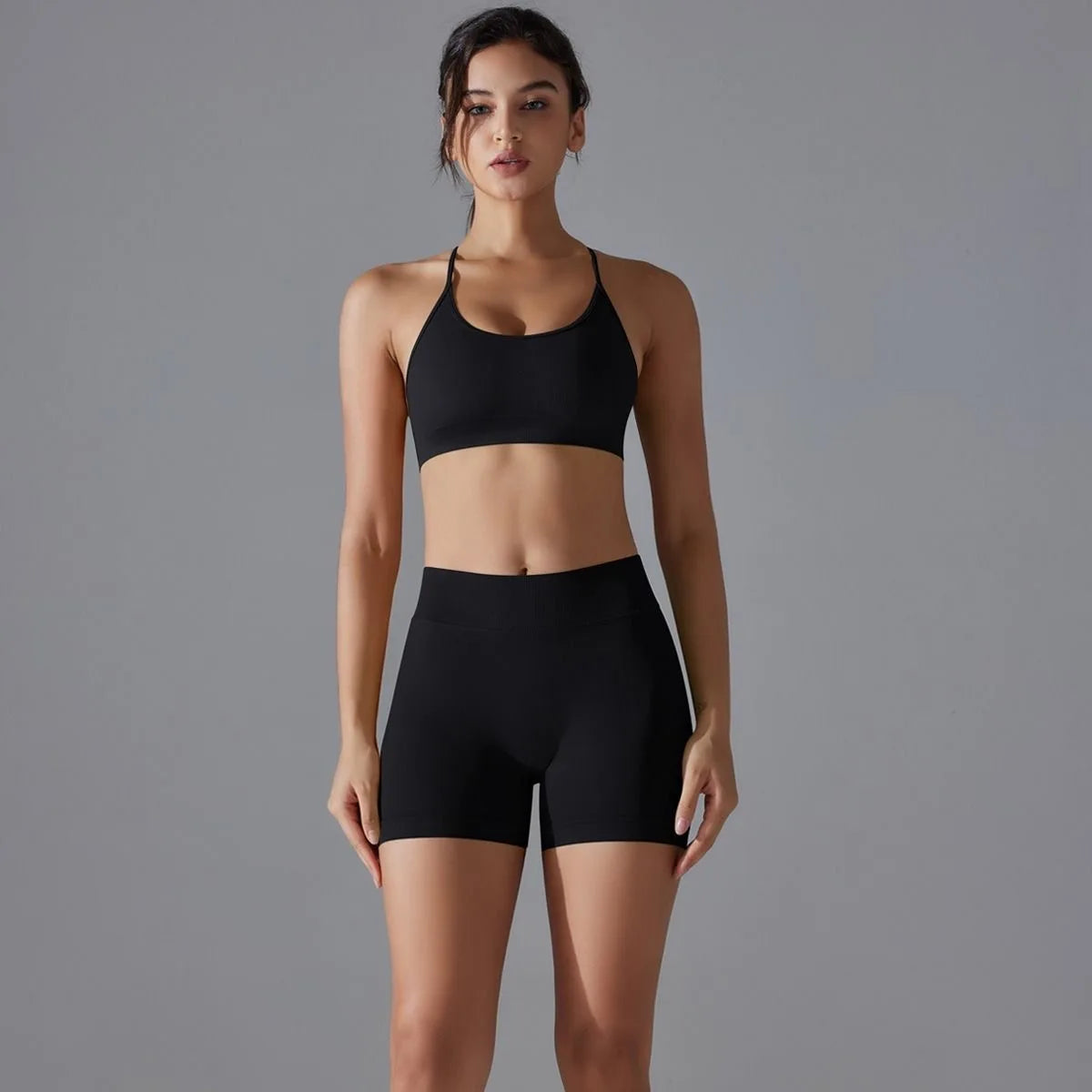 KiKis women's seamless gym set in black featuring a sports bra and high-waisted shorts for workouts