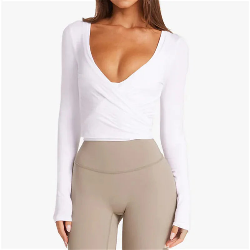 KiKis women's cross wrap yoga shirt in white with long sleeves and deep V neckline
