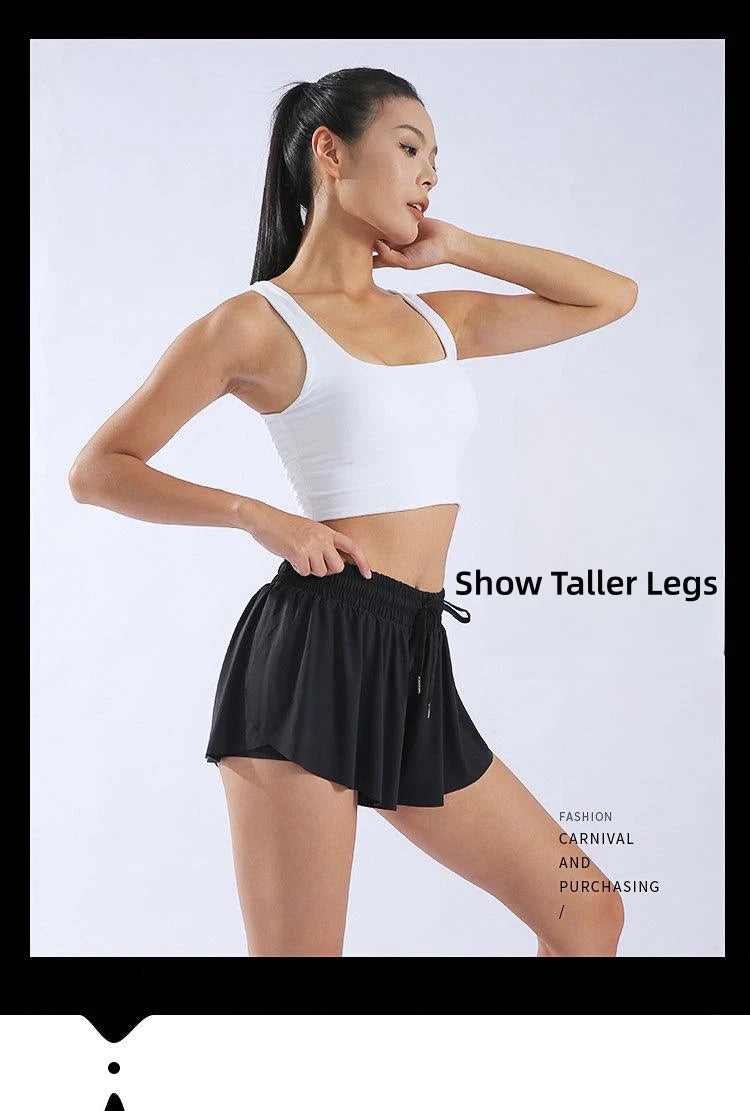 KiKis black yoga running skirt shorts for women worn by model with white tank top