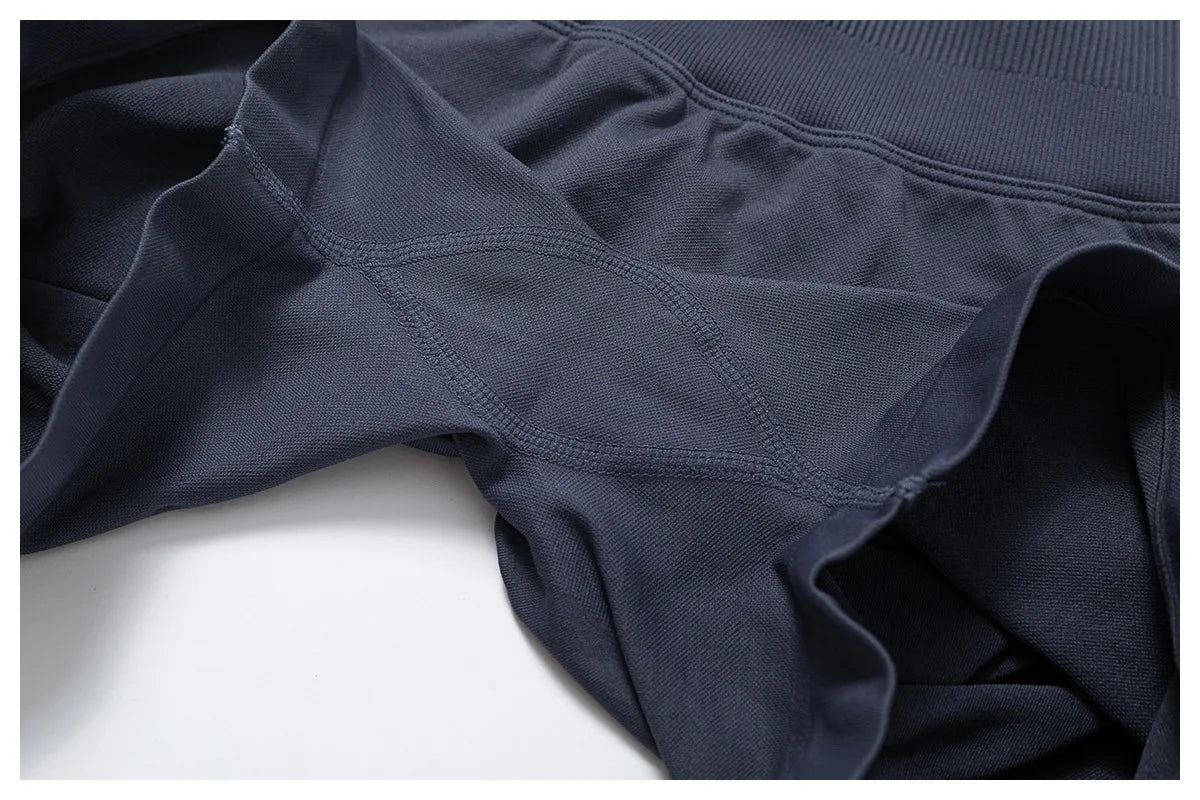Close-up of black fabric detailing on women's seamless gym set by KiKis showing stretch and texture
