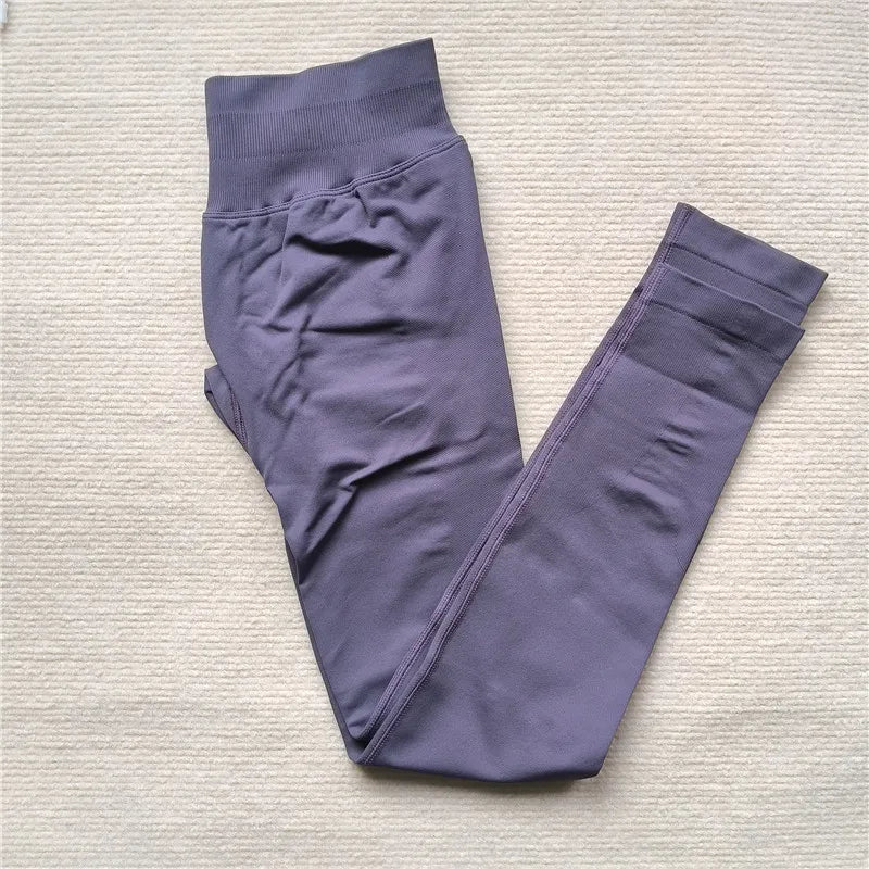 KiKis Women Scrunch Butt Seamless Leggings in purple folded on a light background