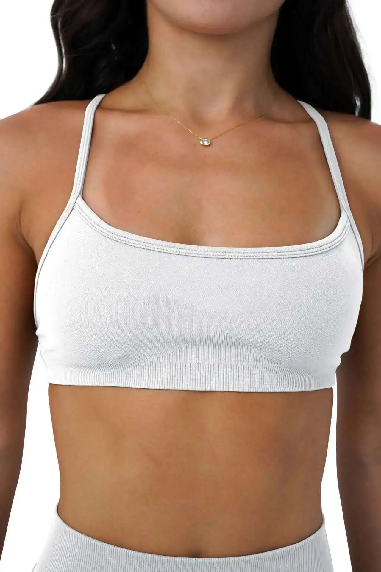 KiKis white seamless sports bra for women with thin straps and smooth fabric for comfort