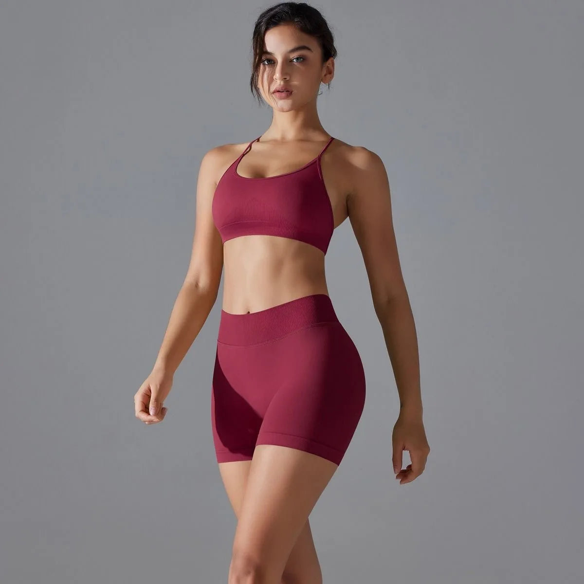 KiKis women's seamless gym set in burgundy with a crop top and high-waisted shorts