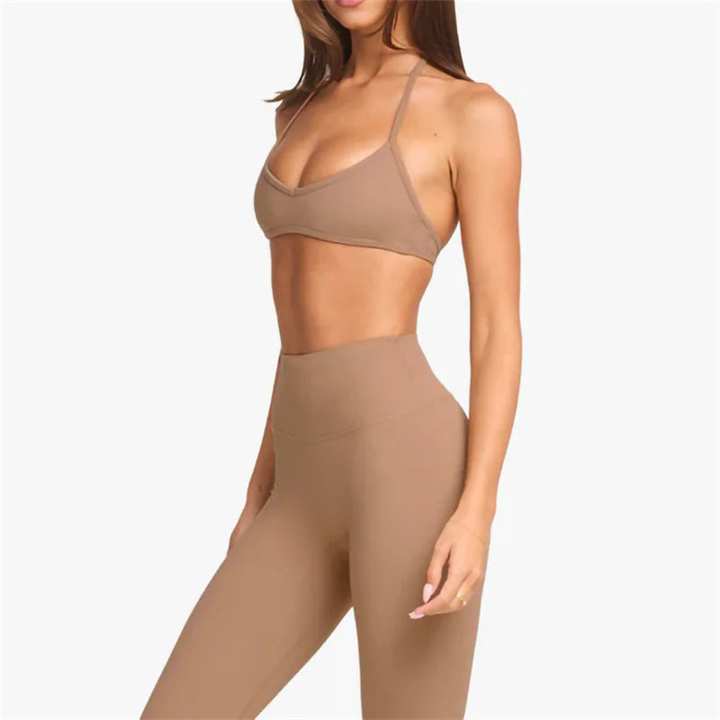 KiKis women's cross wrap yoga shirt in beige worn with matching high-waist leggings