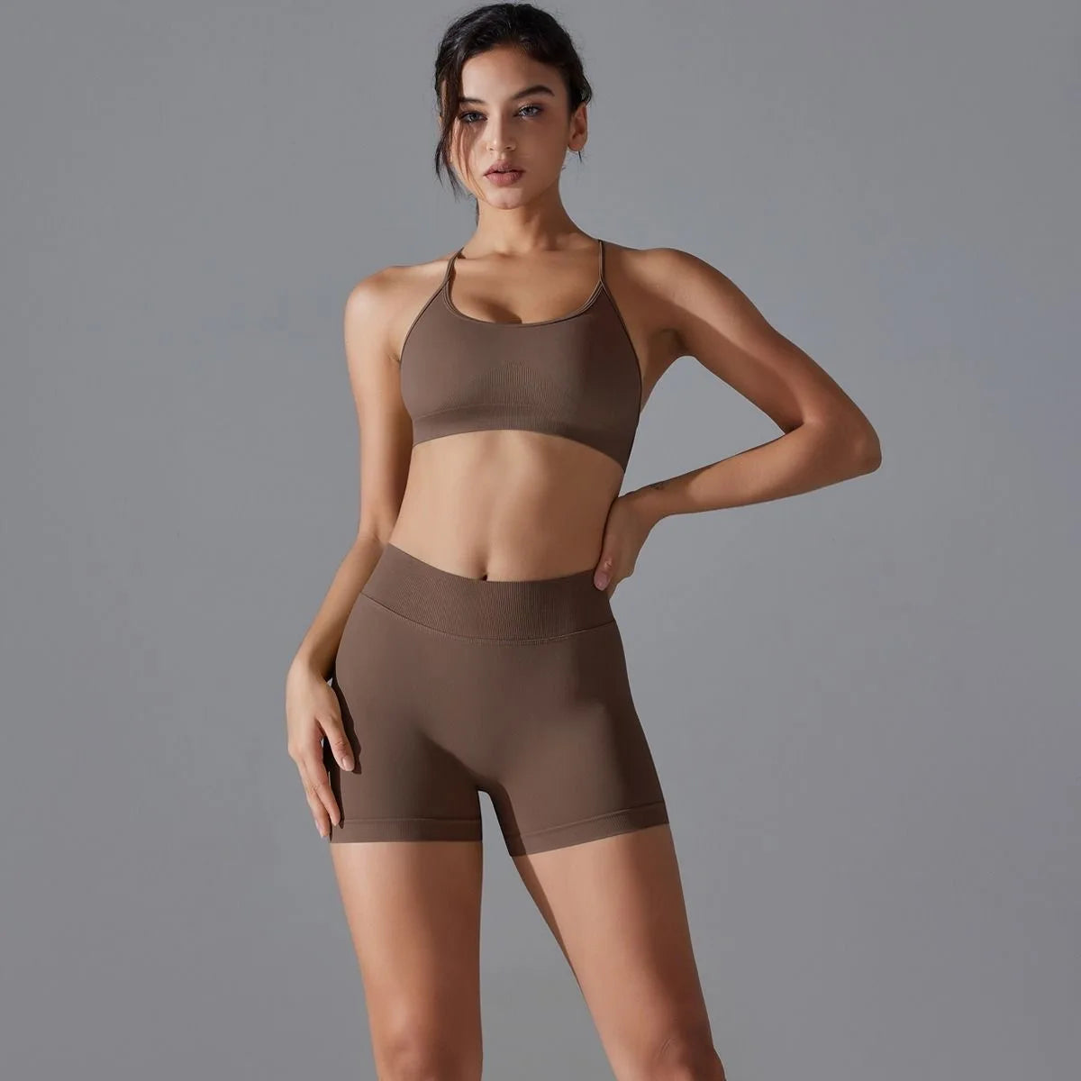 KiKis women's seamless gym set in brown featuring a sports bra and high-waisted bike shorts