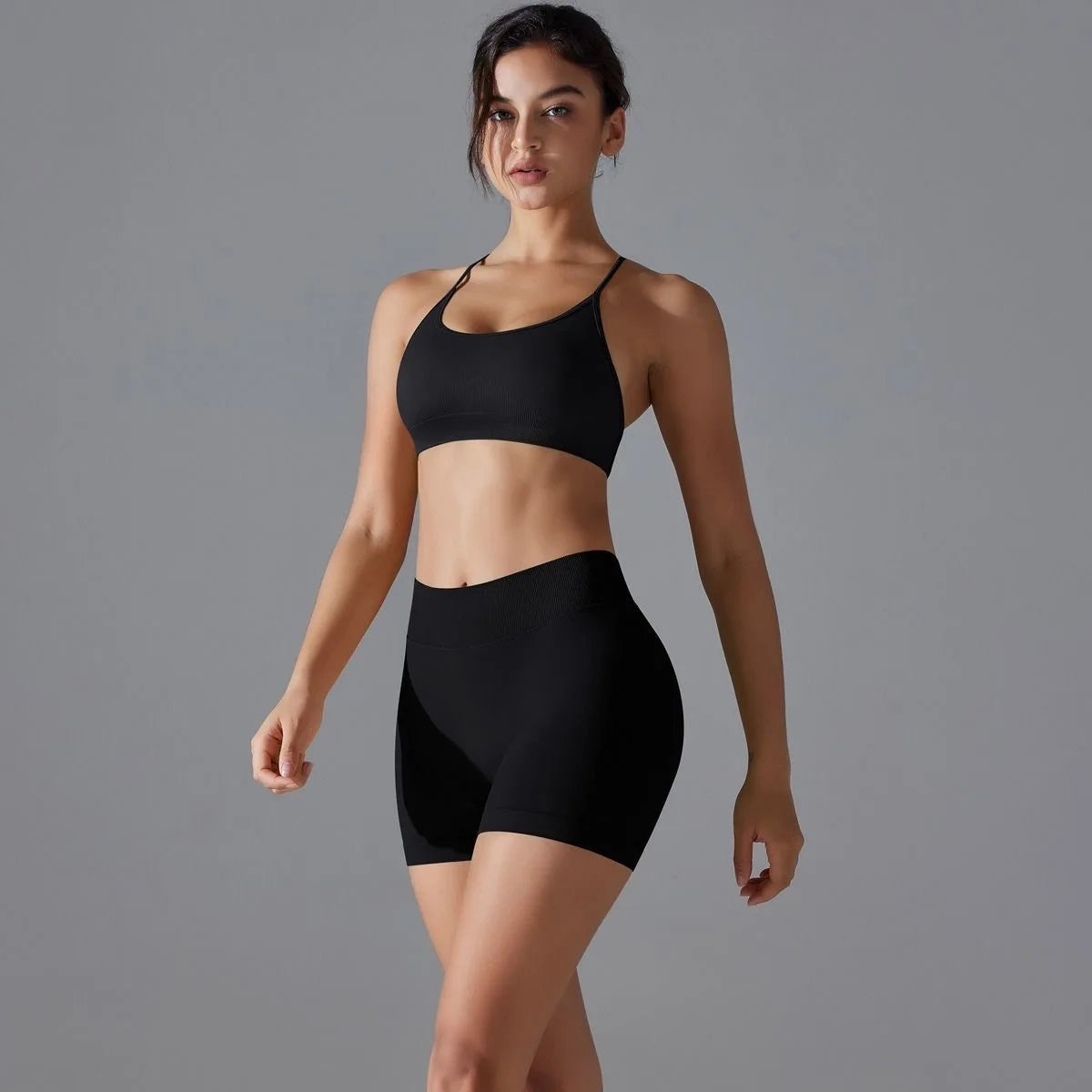 KiKis women's seamless gym set in black with a crop top and high-waisted shorts for workout comfort