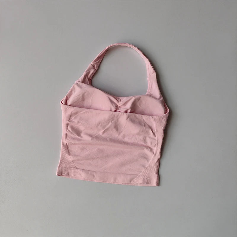 KiKis pink halter neck sports bra for women with soft fabric and comfortable fit