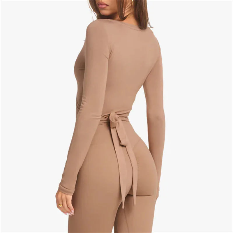 KiKis women's cross wrap yoga shirt in beige with long sleeves and back tie detail