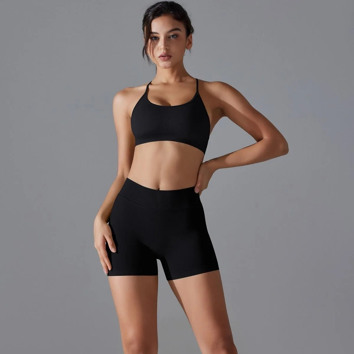 KiKis black women's seamless gym set featuring a sports bra and high-waisted shorts