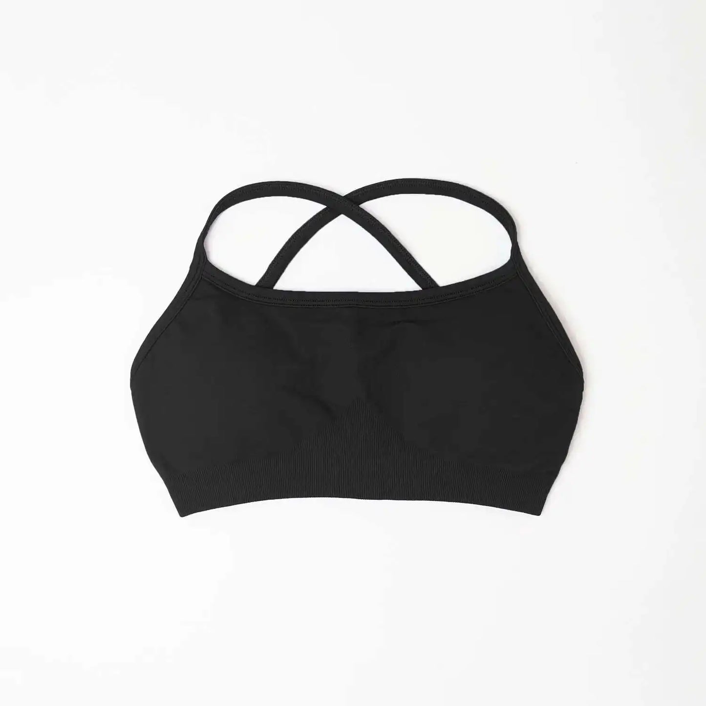 KiKis black seamless sports bra for women with crisscross back straps on white background