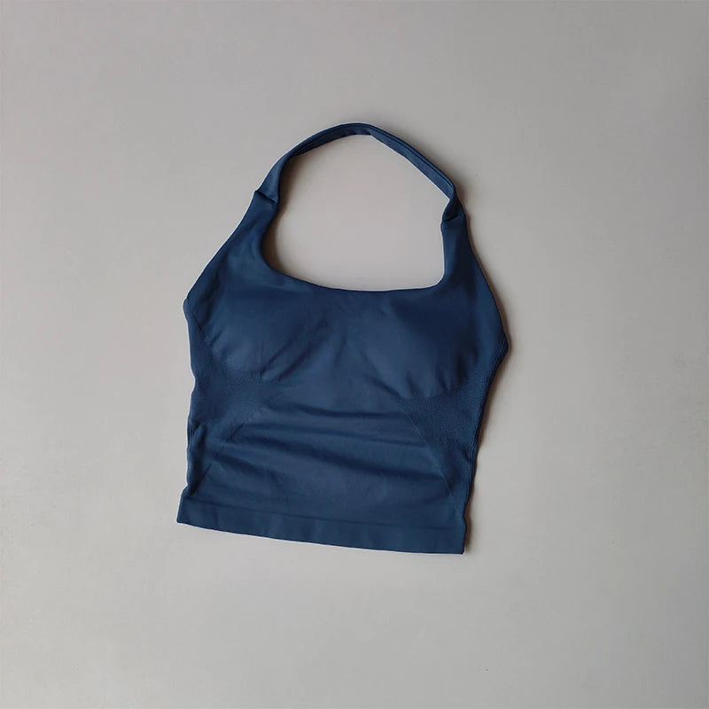 KiKis navy blue halter neck sports bra for women laid flat on gray background