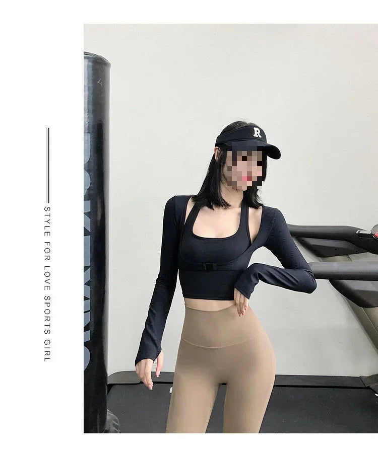 Sexy women's yoga crop top in black worn with beige leggings and a black cap in gym setting