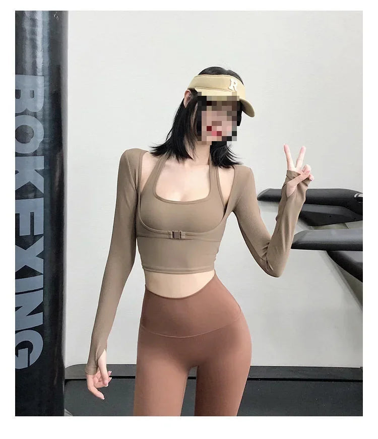 KiKis sexy women's yoga crop top in beige with long sleeves worn by a woman at the gym