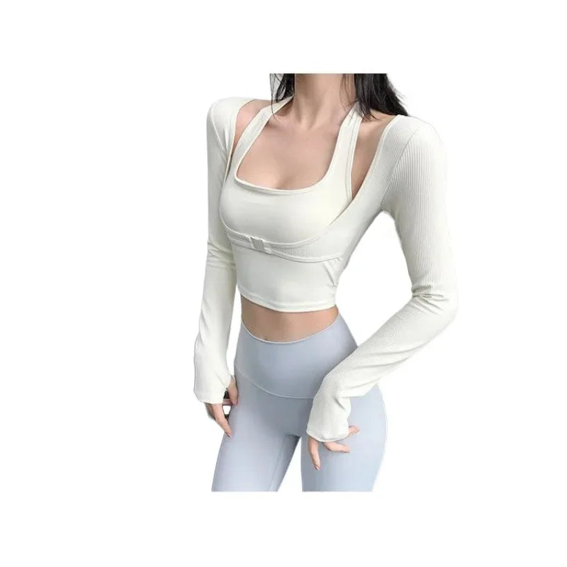 KiKis white sexy women's yoga crop top with long sleeves worn with light blue leggings