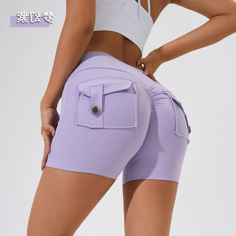 KiKis women's scrunch booty shorts in light purple with buttoned back pockets and ruched design