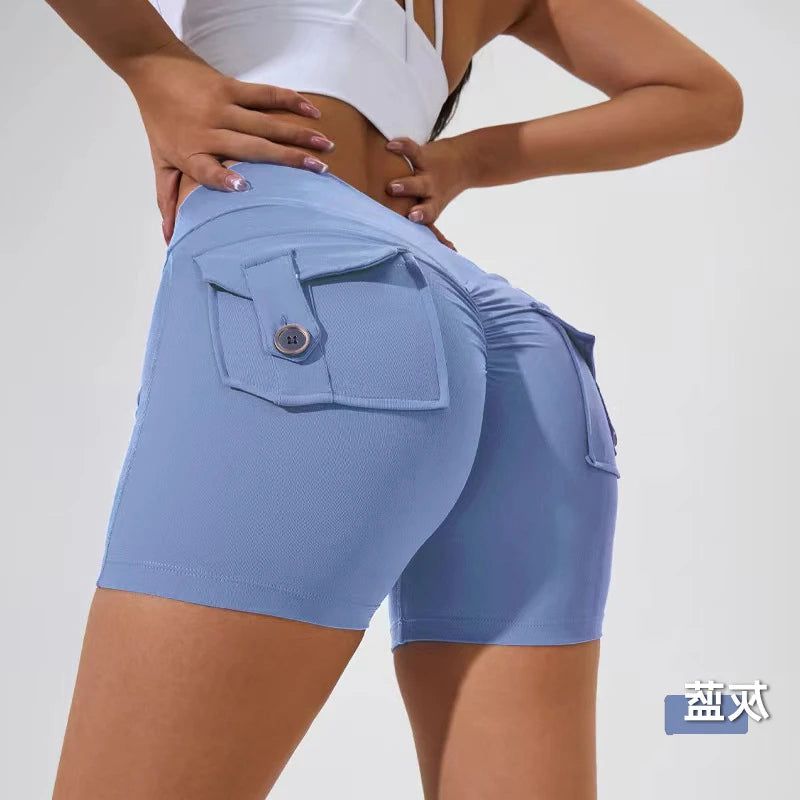 KiKis women's scrunch booty shorts in light blue with buttoned back pockets and ruched detailing