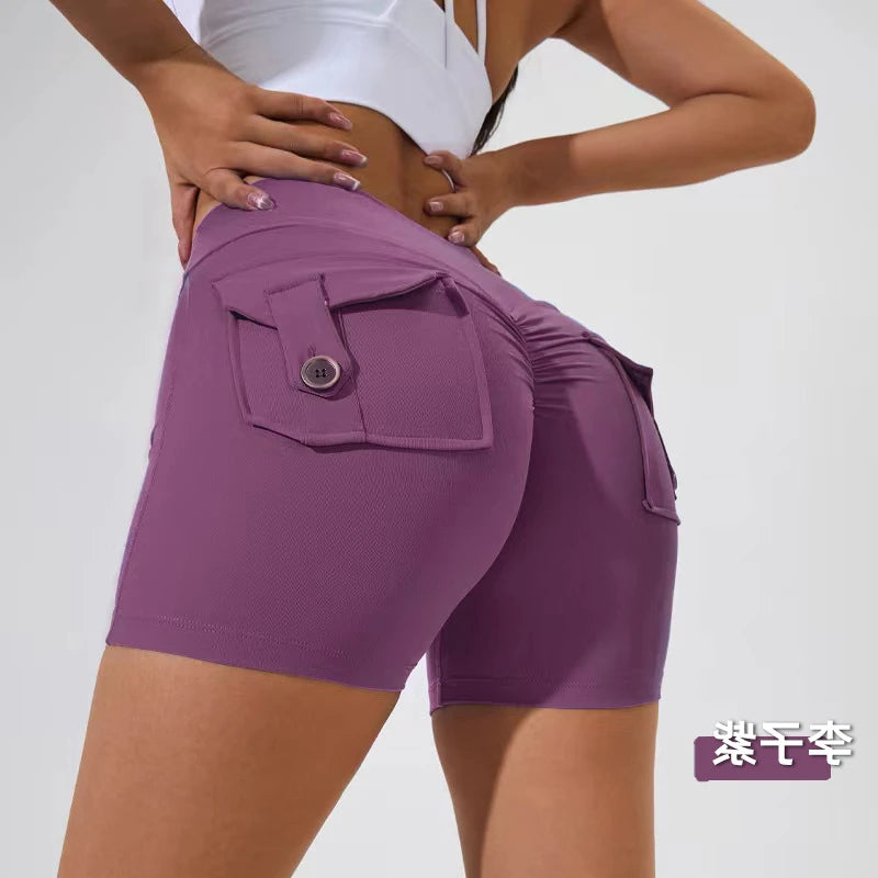 KiKis women's scrunch booty shorts in purple with buttoned back pockets and ruched design