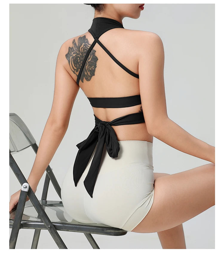 Woman wearing KiKis comfortable workout tank tops for women with stylish back tie design