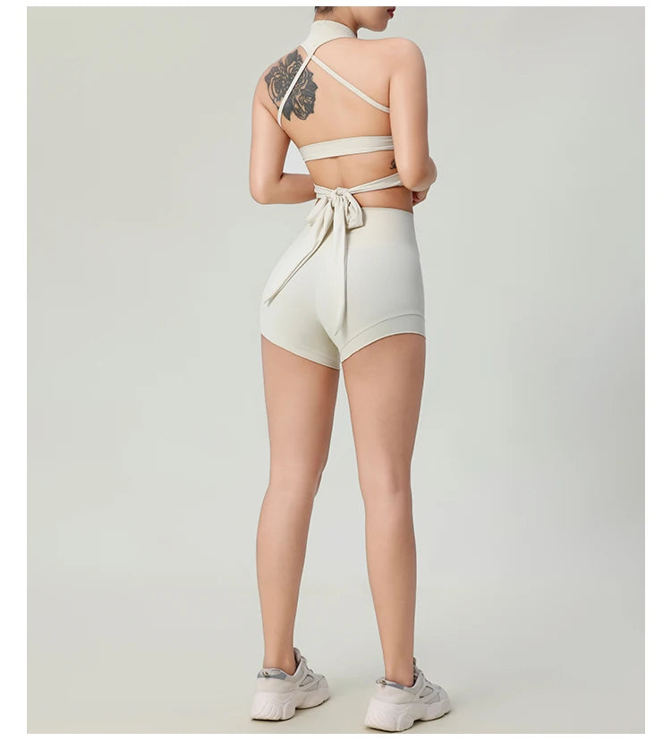 Woman wearing comfortable workout tank tops for women in beige with matching shorts and sneakers