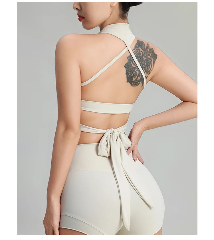 KiKis comfortable workout tank tops for women in beige with crisscross back straps and bow tie detail
