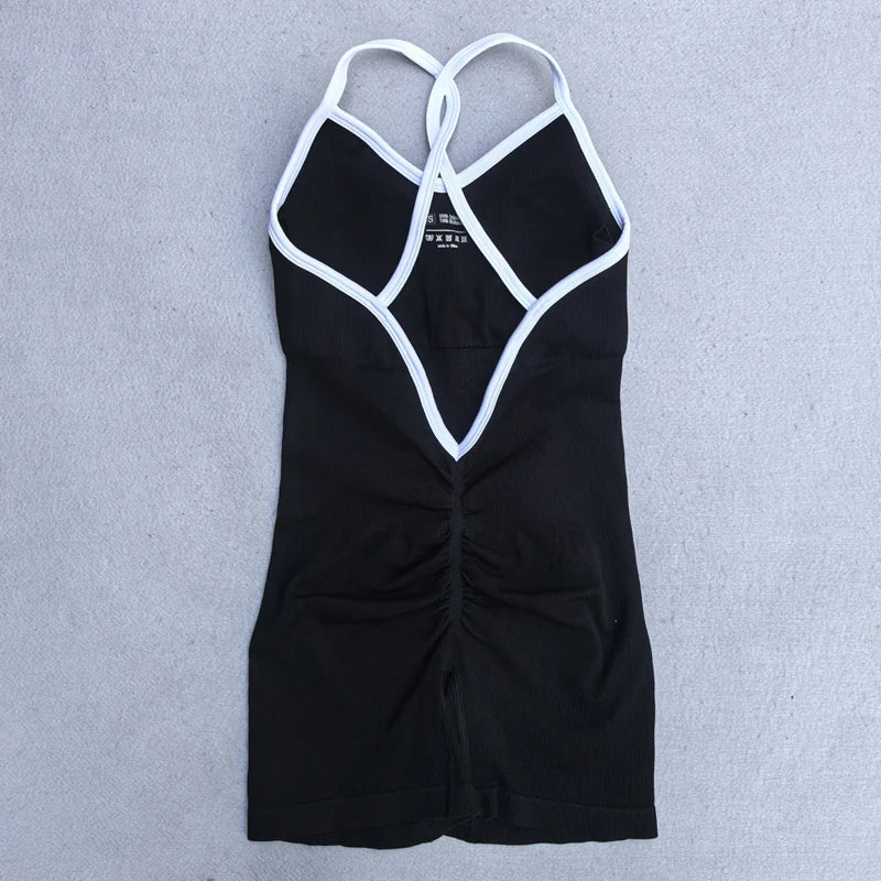 KiKis black cross back strappy jumpsuit with white trim and ruched detailing