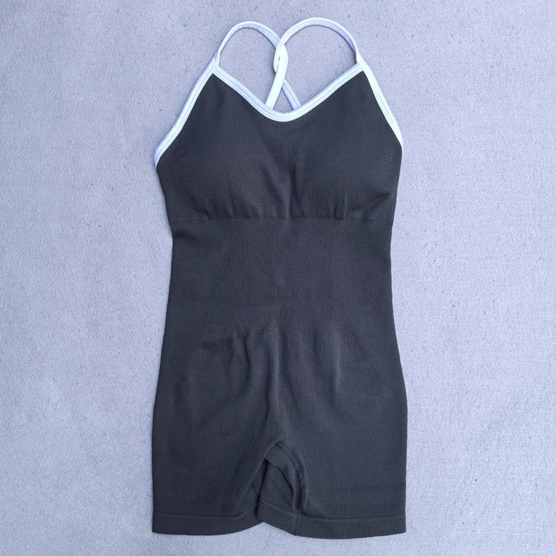 KiKis black cross back strappy jumpsuit with white trim and fitted shorts style