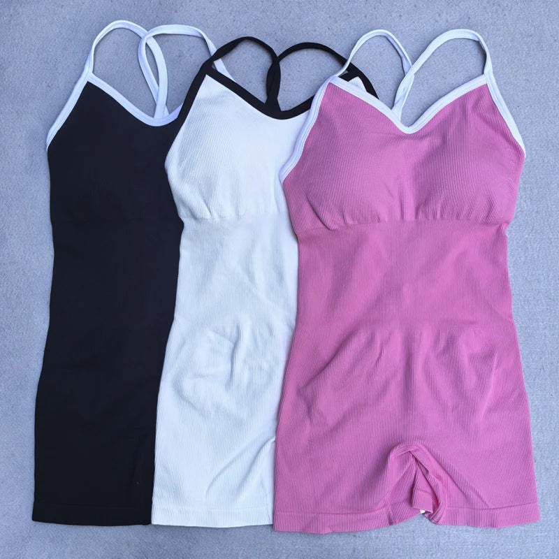 KiKis cross back strappy jumpsuit in black white and pink colors with fitted design