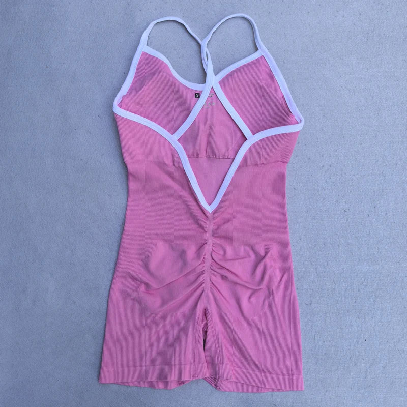 KiKis pink cross back strappy jumpsuit with white trim and ruched front detailing