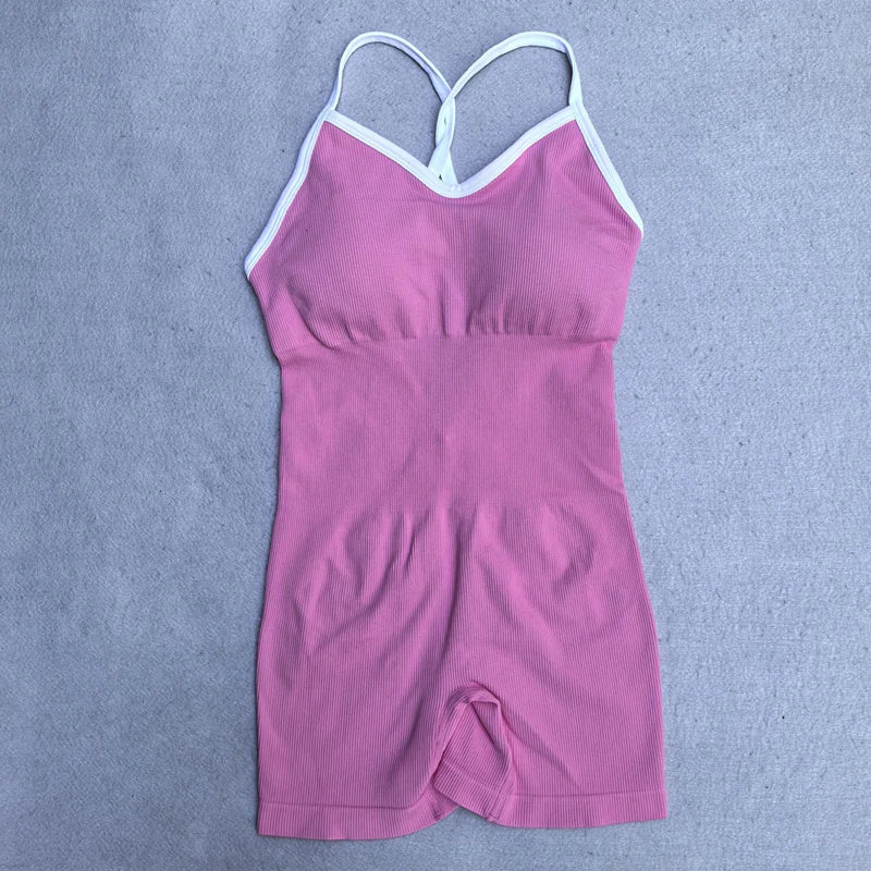 KiKis pink cross back strappy jumpsuit with white trim on straps and neckline
