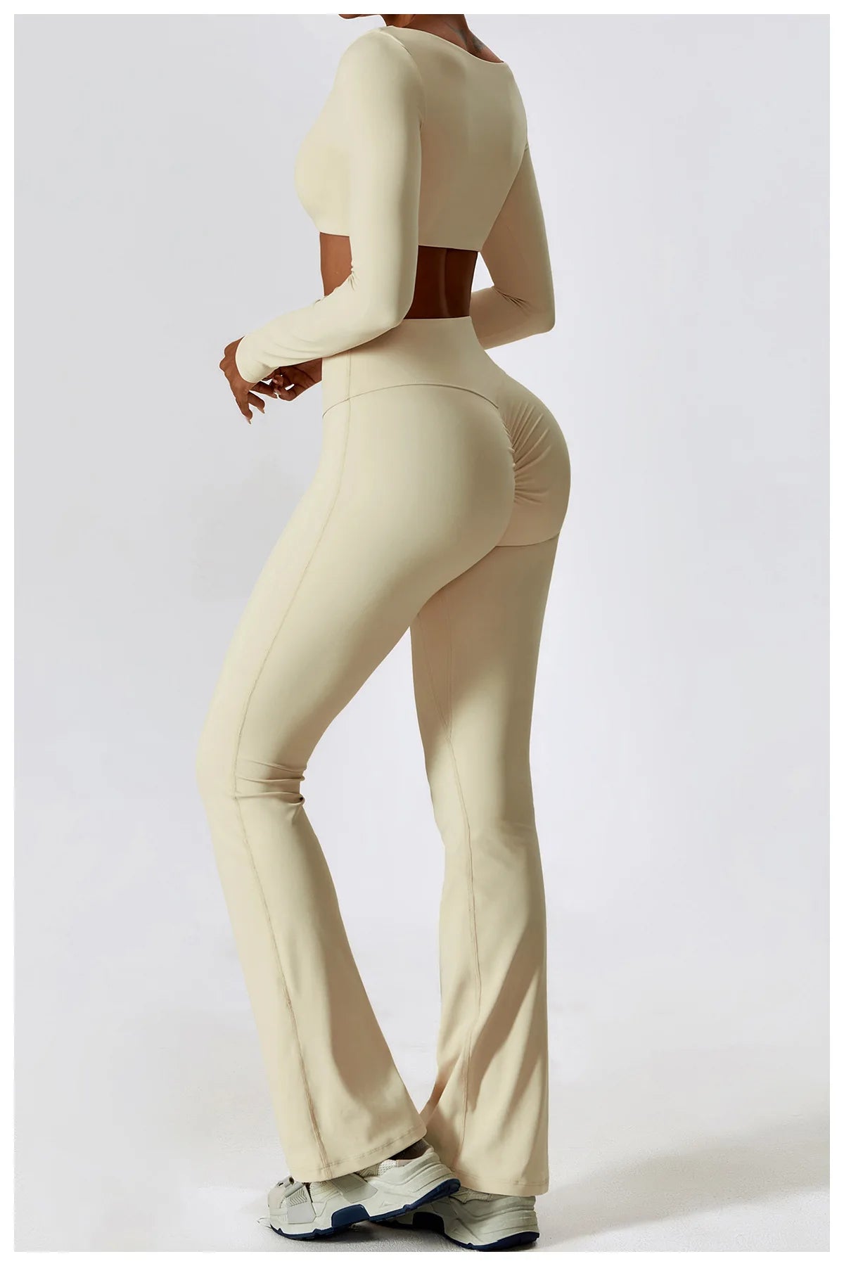 KiKis beige 2 piece workout set for women with long sleeve crop top and fitted flared leggings