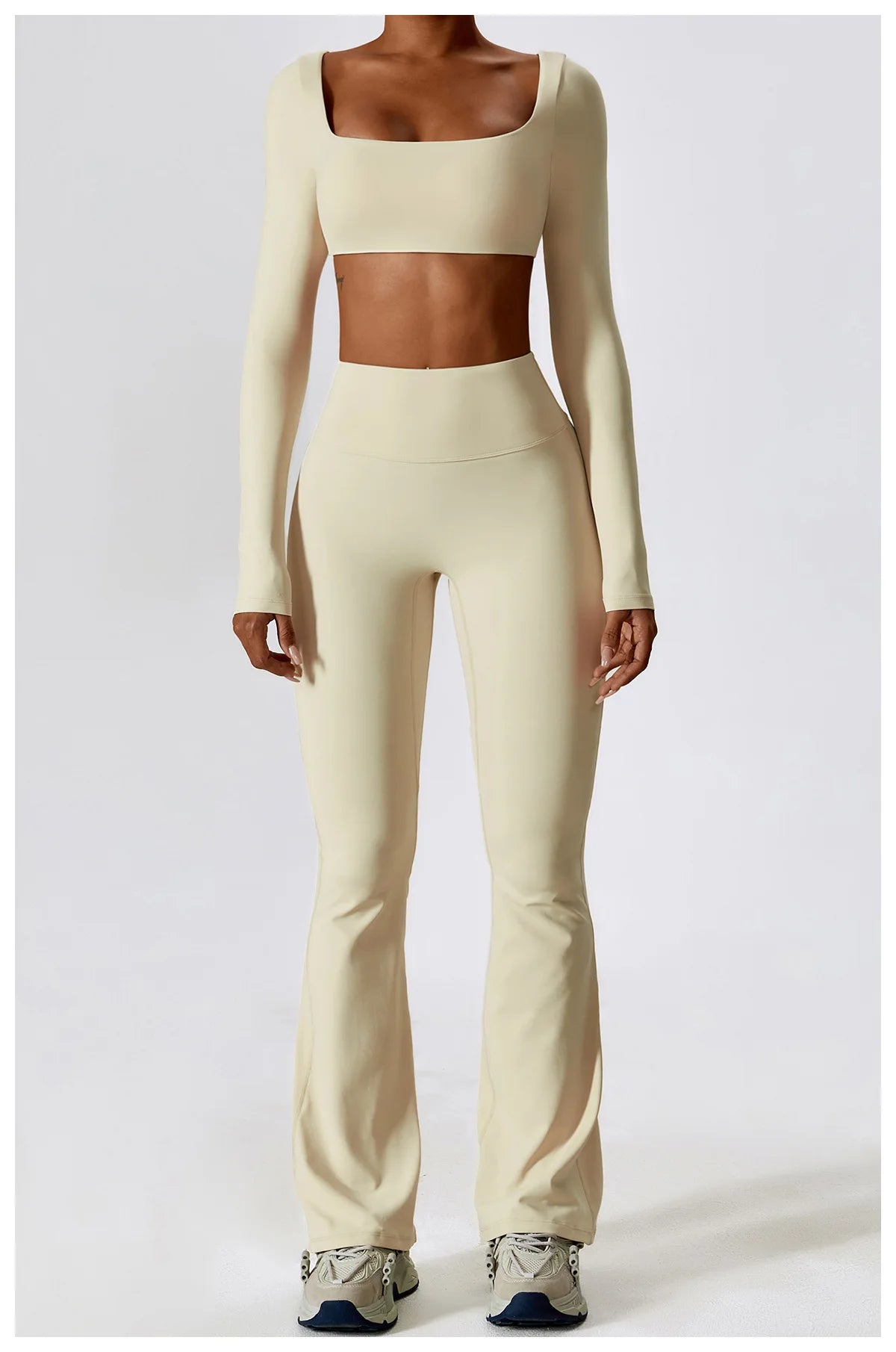 KiKis beige 2 piece workout set for women with long sleeve crop top and flared leggings