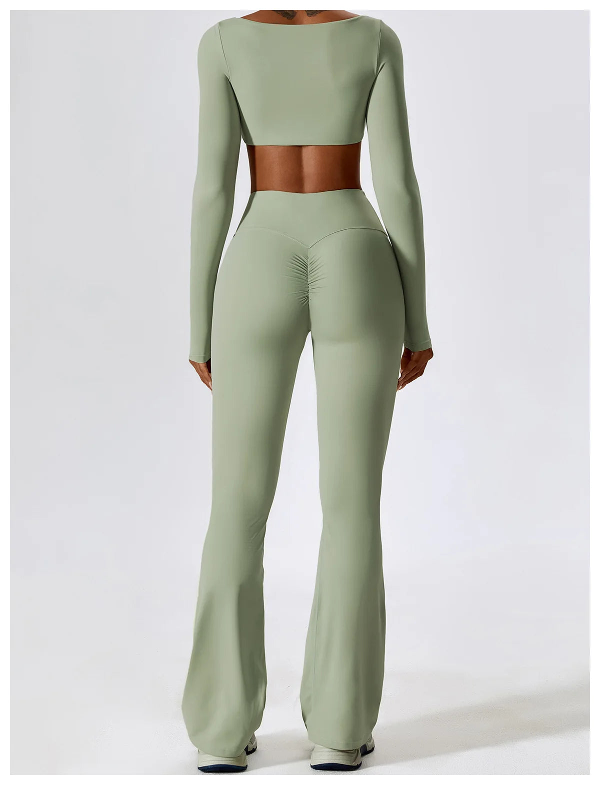 KiKis 2 piece workout set for women in light green with long sleeves and high-waisted flared pants