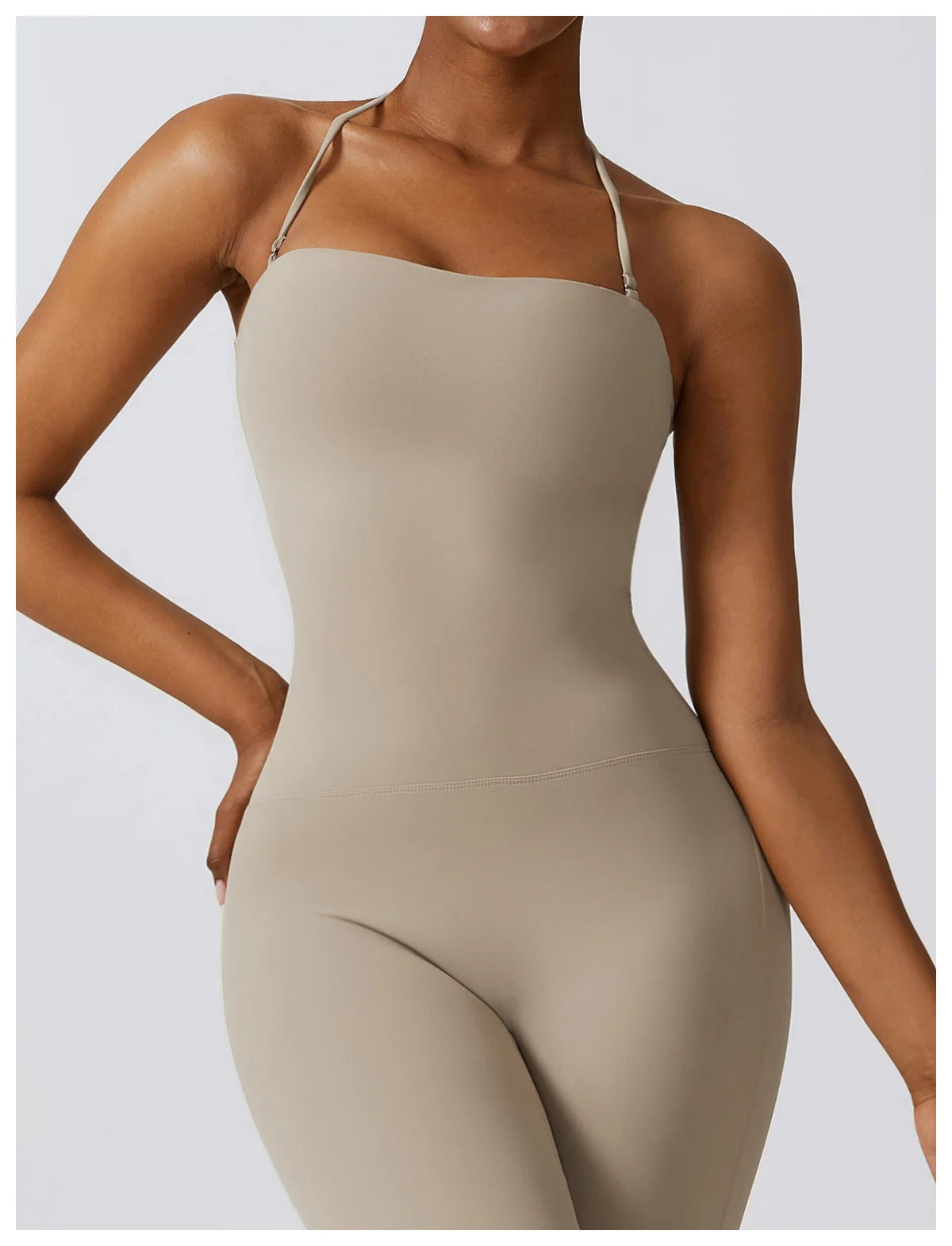 KiKis beige one piece yoga suit for women with thin straps and a fitted design