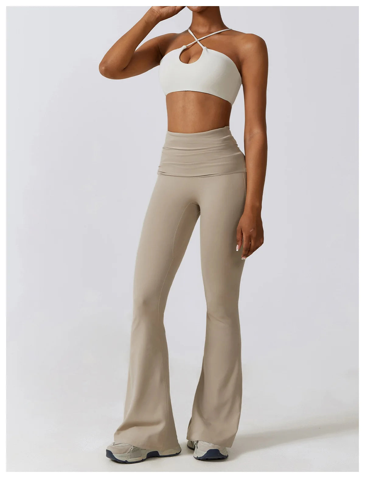 KiKis one piece yoga suit for women in beige with flared pants and strappy white crop top