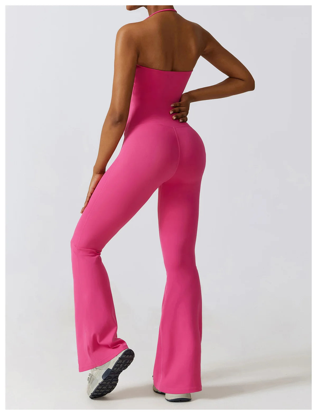 KiKis one piece yoga suit for women in bright pink with a strapless design and flared legs