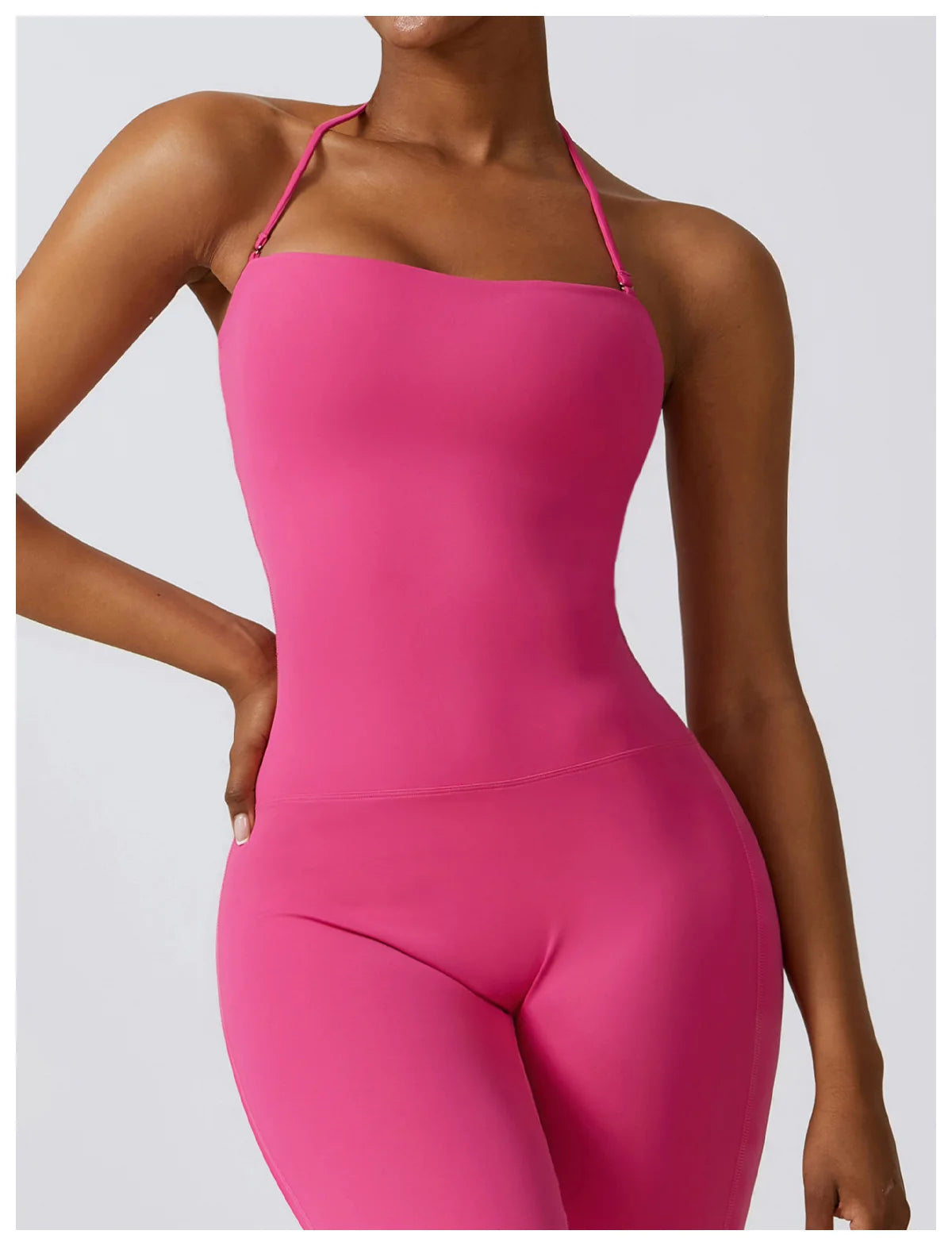KiKis one piece yoga suit for women in bright pink with slim fit and thin halter straps