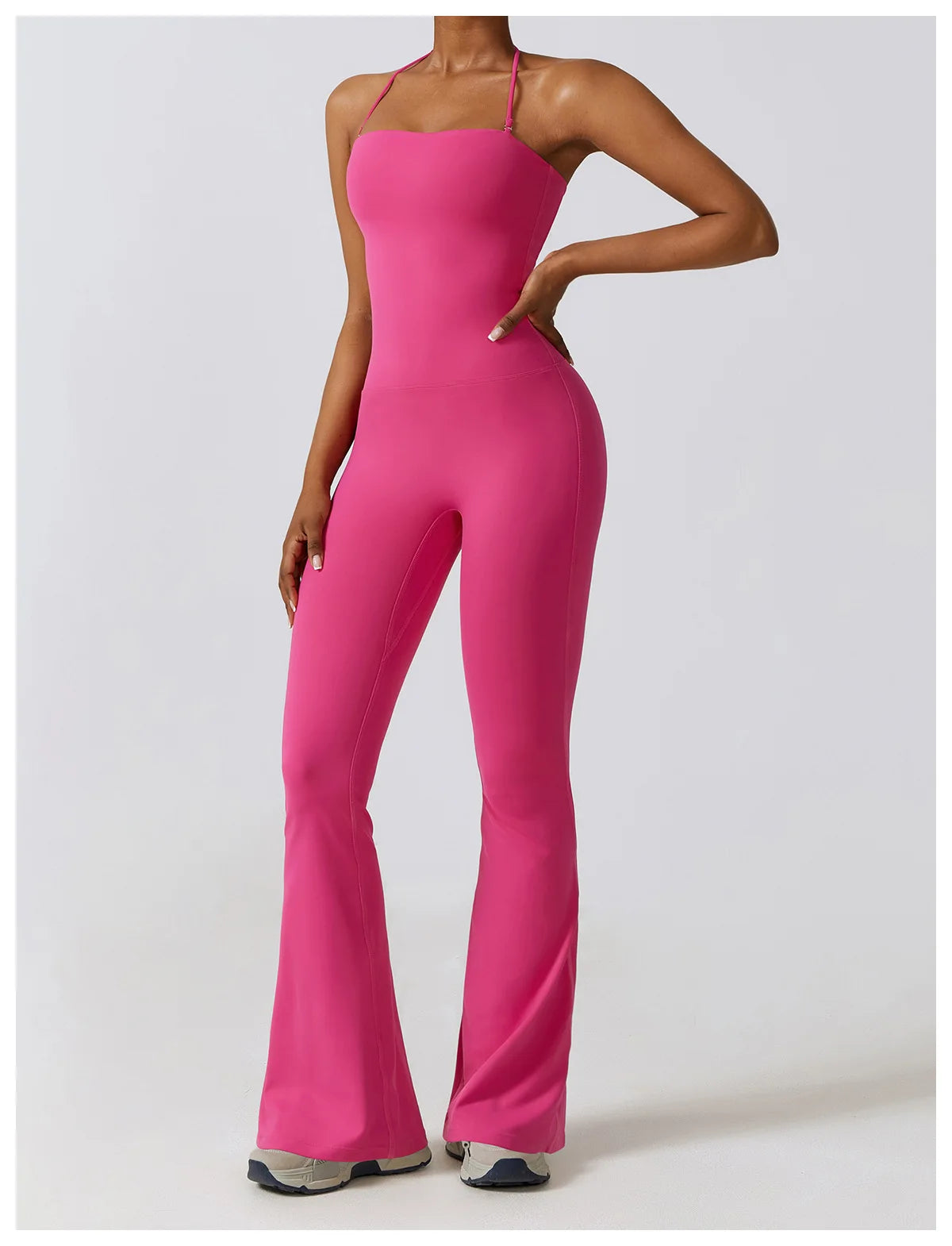 KiKis vibrant pink one piece yoga suit for women with thin straps and flared legs
