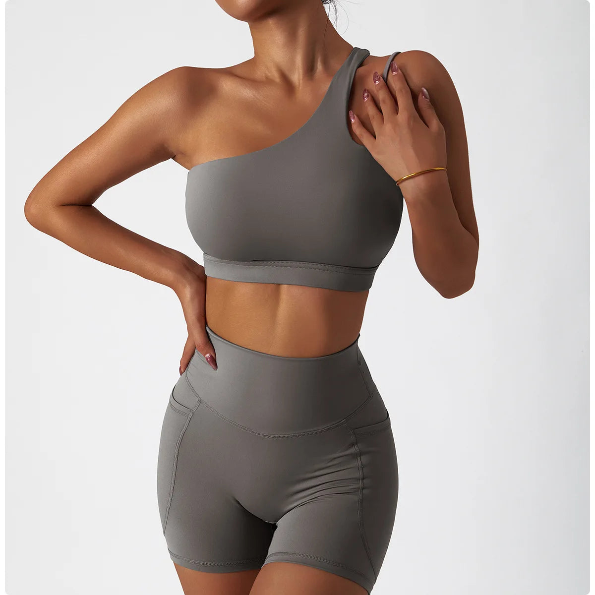 KiKis one shoulder sports bra and leggings set in gray fitted design for activewear