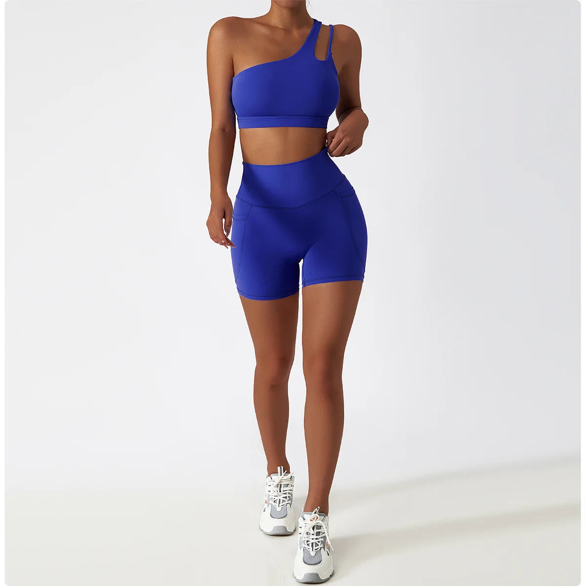 KiKis blue one shoulder sports bra and leggings set with high-waisted shorts and athletic fit