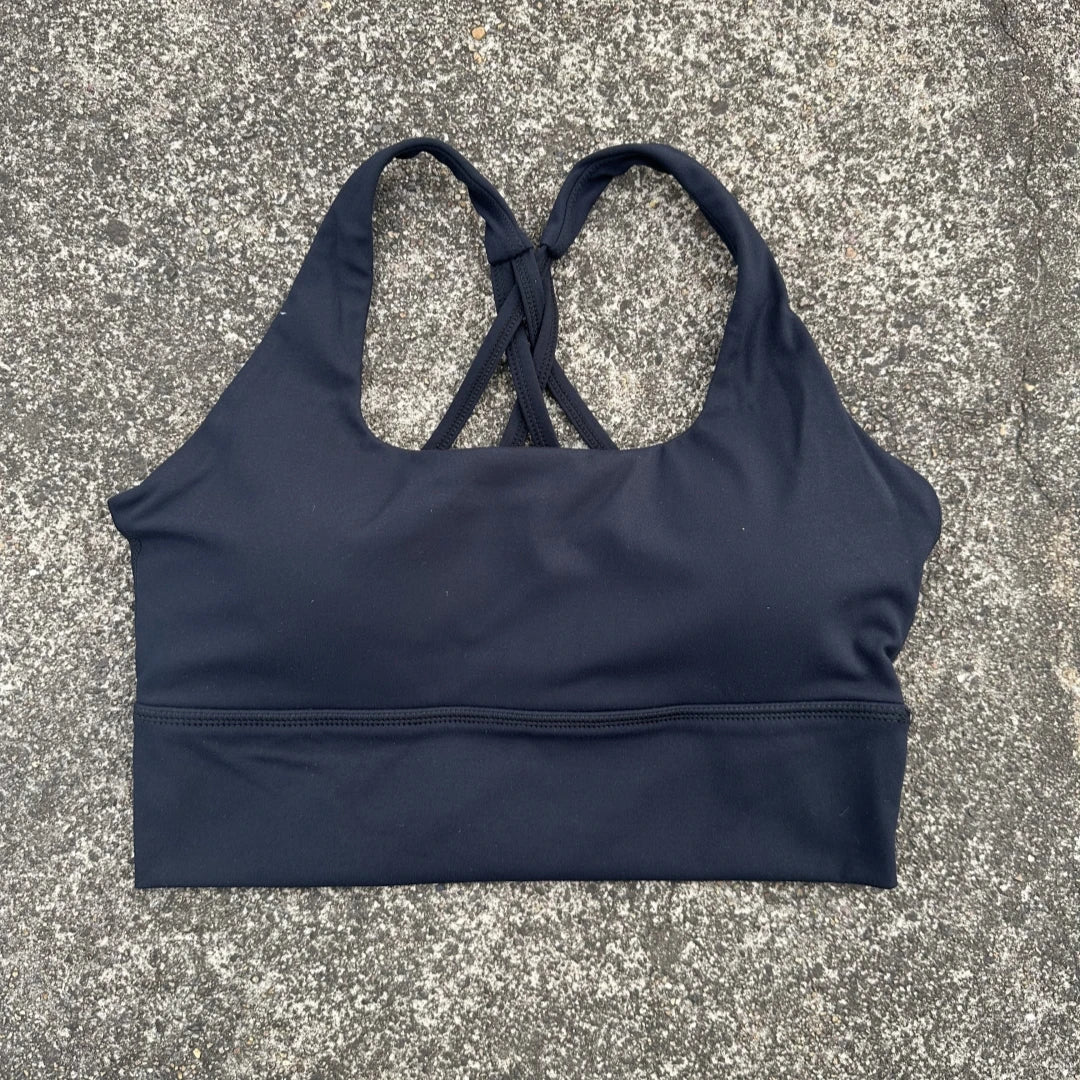 Black cross back sports bra for women by KiKis with comfortable fabric and supportive fit