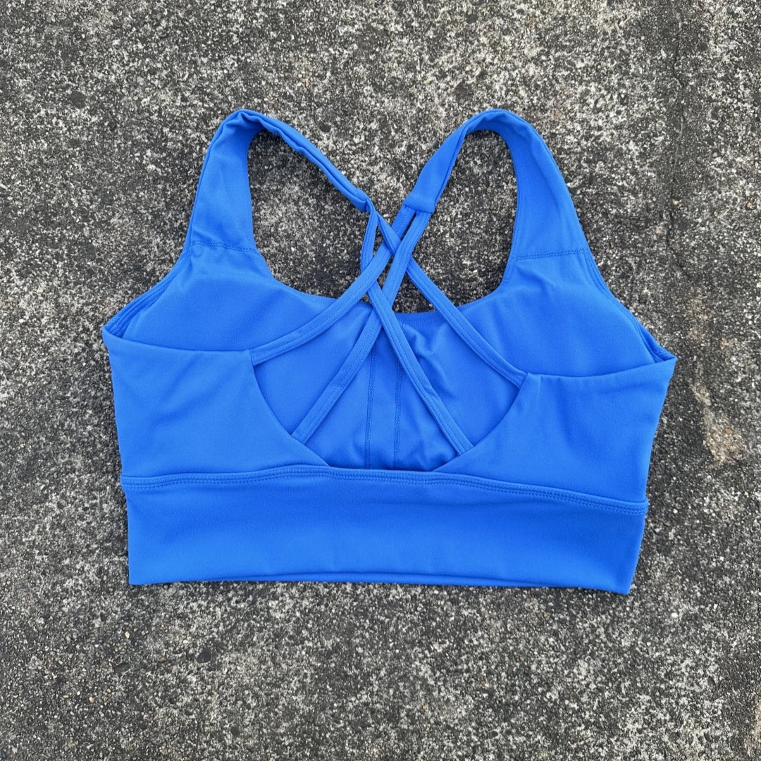 KiKis blue cross back sports bra for women with adjustable straps and supportive fit