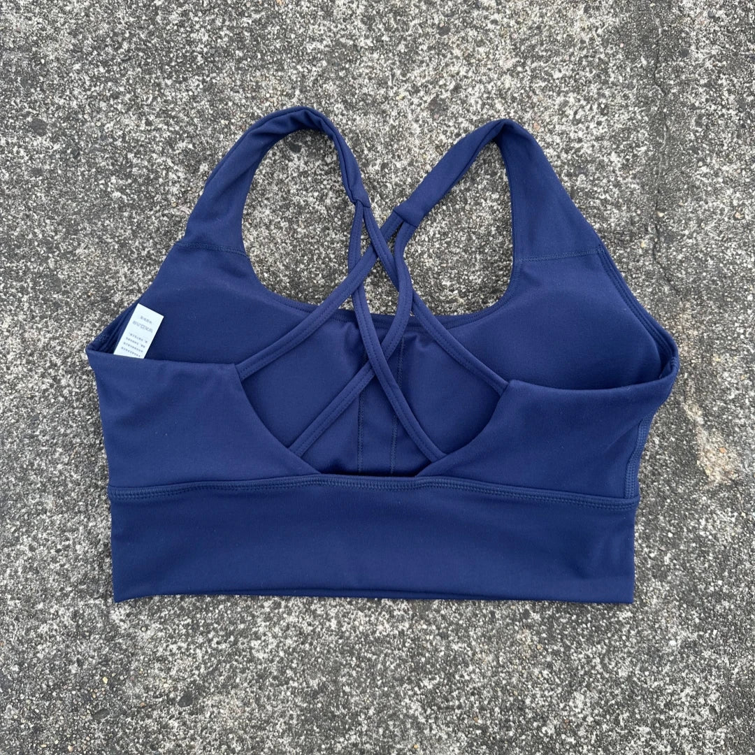 KiKis navy blue cross back sports bra for women with double strap design and supportive fit