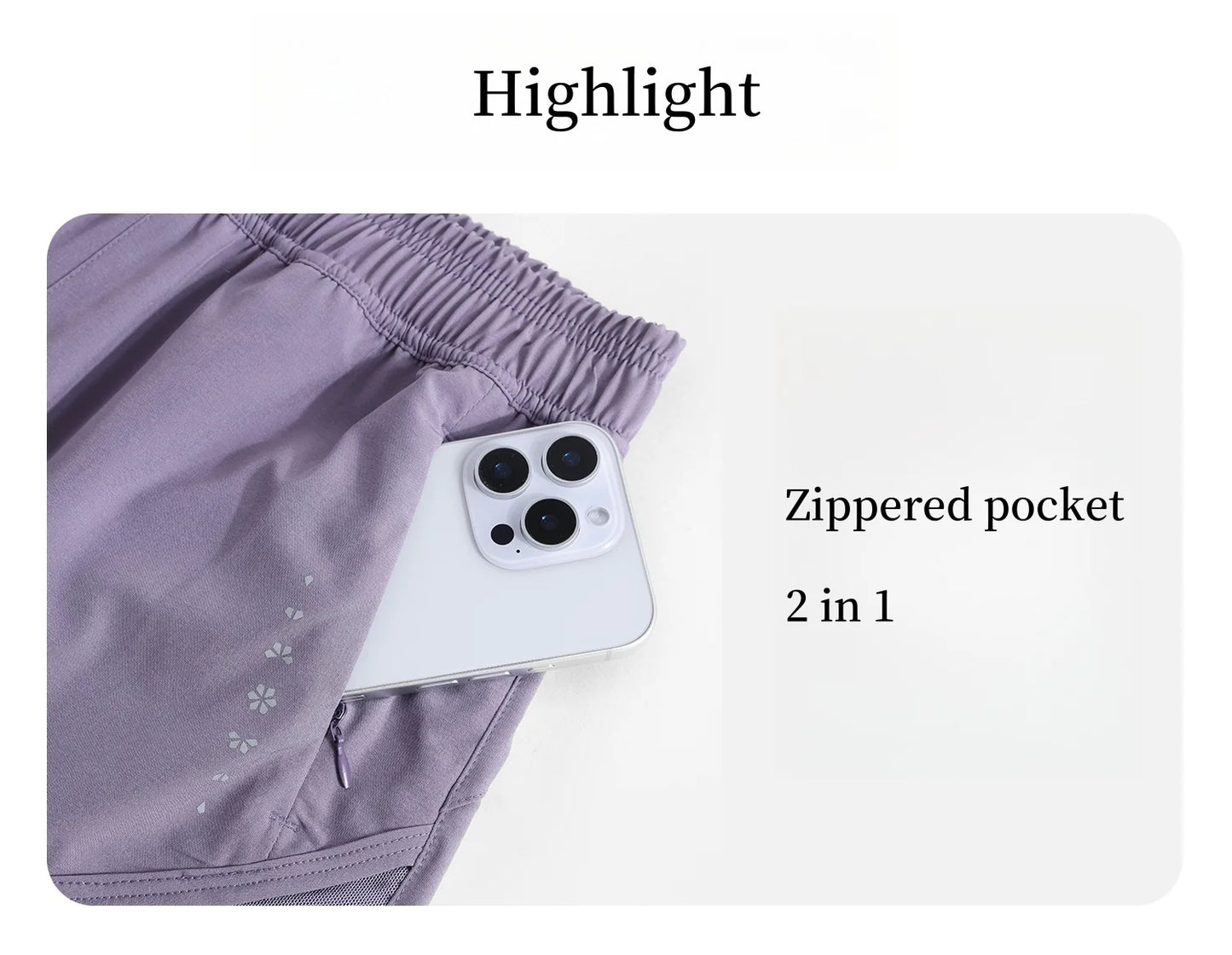 KiKis high waist running shorts for women in purple with zippered pocket holding a smartphone