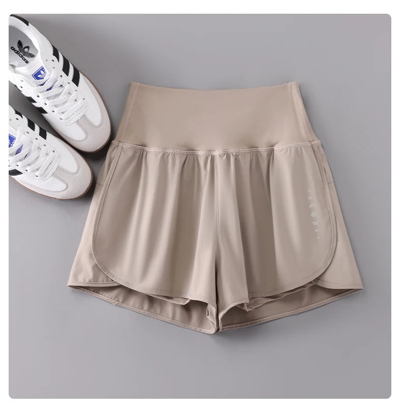KiKis Womens Running Shorts in beige with high waistband and lightweight fabric
